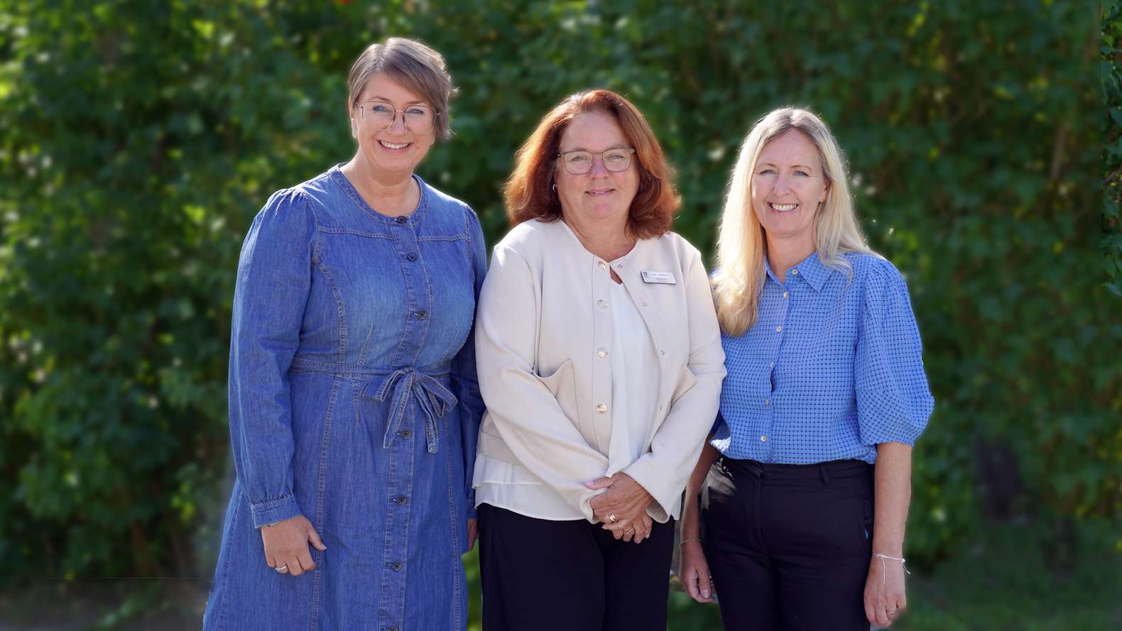 Porträttbild på tre personer